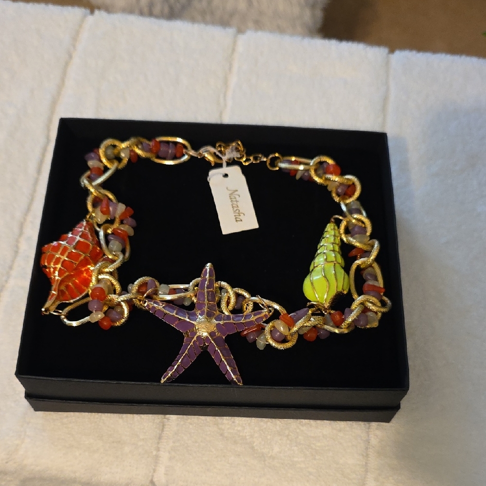 Natasha Couture Gold Necklace with Purple Starfish and Orange-Green Shells